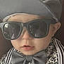 Maverick joined the competition — help win amazing prizes! baby, child, sunglasses, cap, bow_tie, floral_shirt, suspenders, face, headwear, fashion, portrait, cool, closeup, indoor, cute, young_child, person, accessories, hat, eyewear