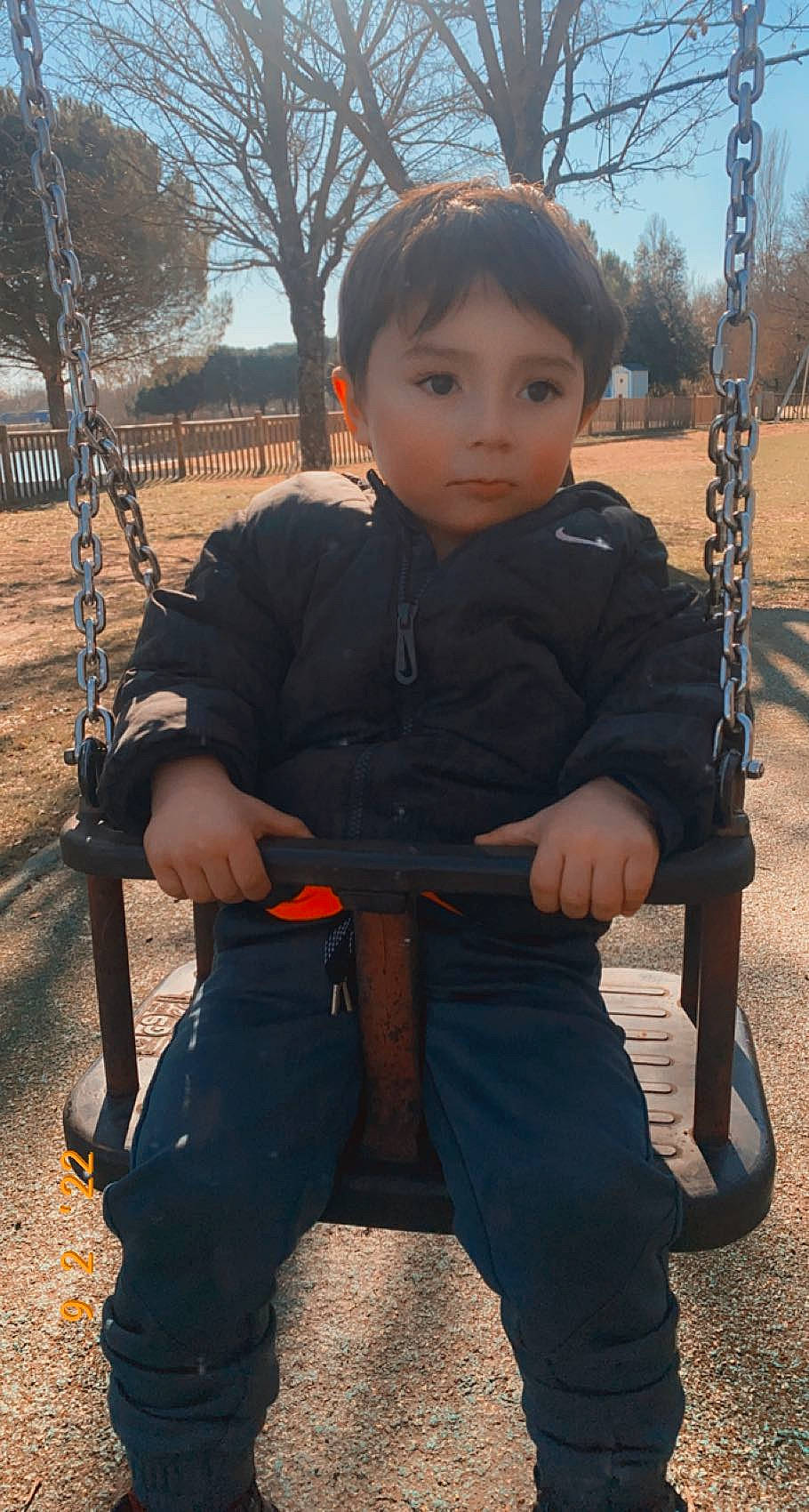 Yabram participe au concours pour gagner de l'argent avec cette photo : arm, chin, cool, eye, face, fun, gesture, grass, hair, happy, head, leisure, outerwear, person, playground, sky, sleeve, standing, swing, toddler