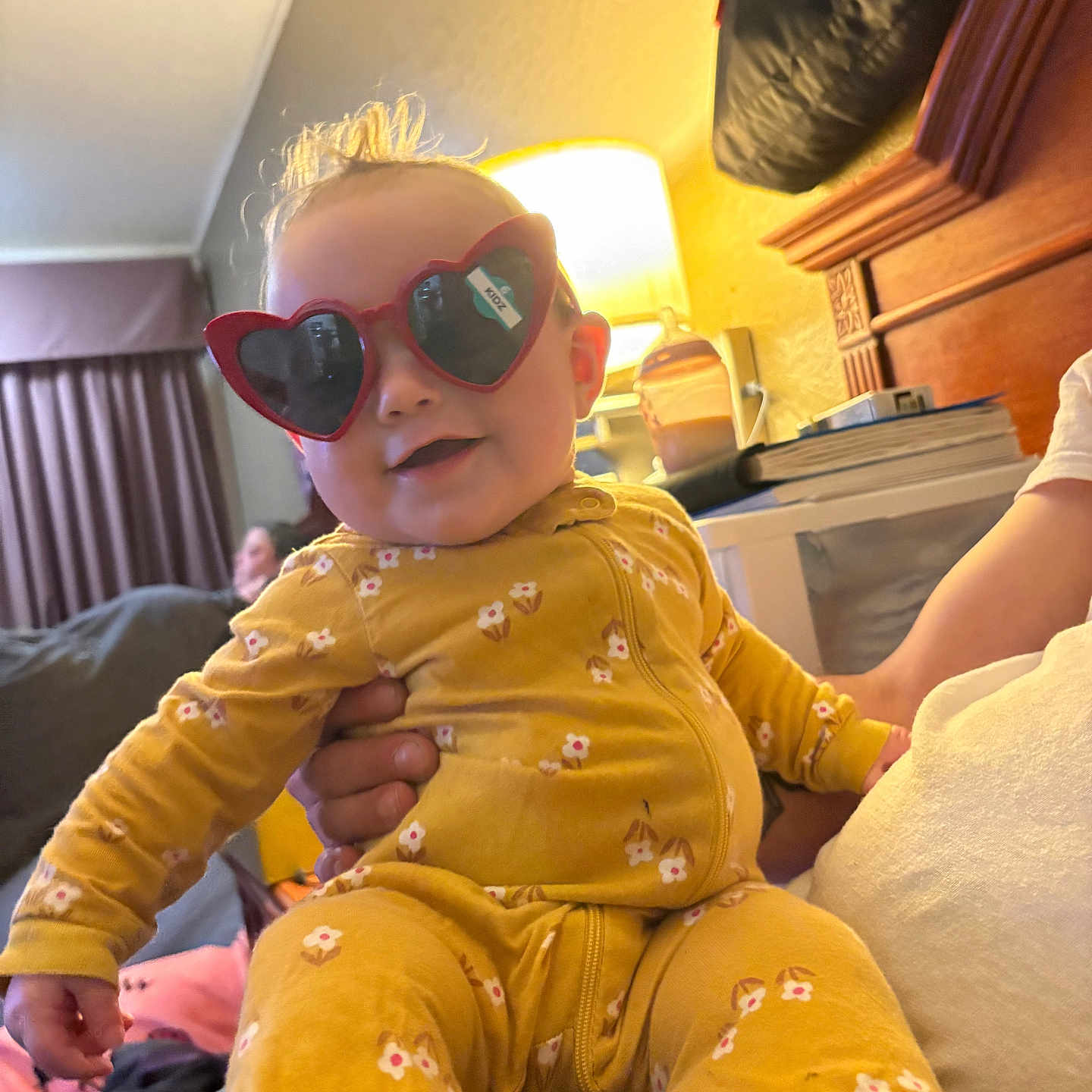 Raylynn is registered to the contest to win money with this photo: accessories, adult, baby, bodypart, couch, cushion, face, female, finger, furniture, head, homedecor, indoors, male, man, person, photography, portrait, sunglasses, woman
