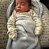 Jayce is registered to the contest to win money with this photo: newborn, baby, sleeping, infant, portrait, blanket, swaddled, blue_blanket, pajamas, soccer_ball, clothing, hood, pillow, bed, indoors, peaceful, resting, face, closed_eyes, photography