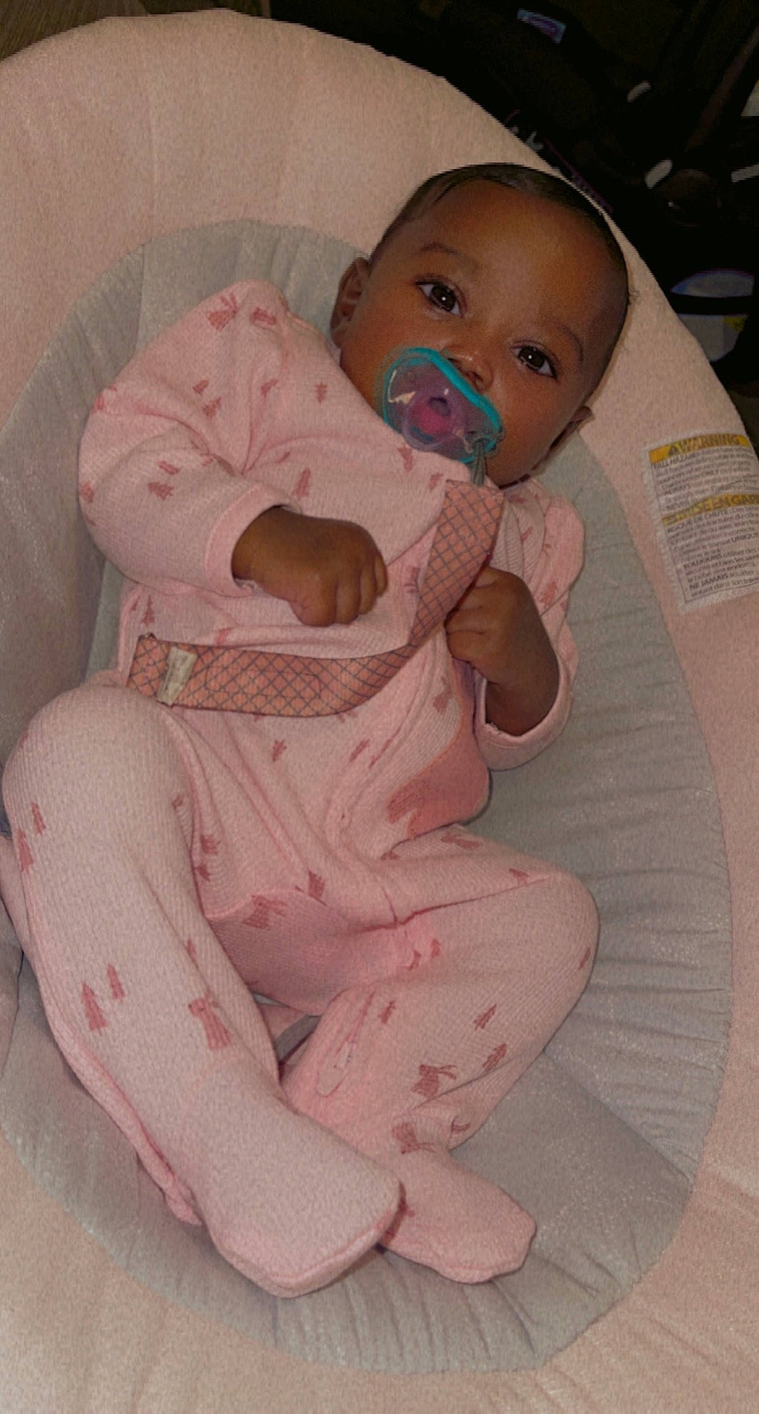 Avah is registered to the contest to win money with this photo: arm, baby, baby_products, baby_toddler_clothing, cheek, child, chin, comfort, eyelash, finger, hand, head, linens, lip, mouth, nose, person, pink, skin, sleeve