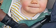 Eden a rejoint le concours — aidez-le/la à gagner de superbes lots ! baby, child, closeup, clothing, cute, face, handlebar, happy, head, indoor, jacket, person, rosy_cheeks, seated, smile, striped_shirt, stroller, transport, wheel, young_child