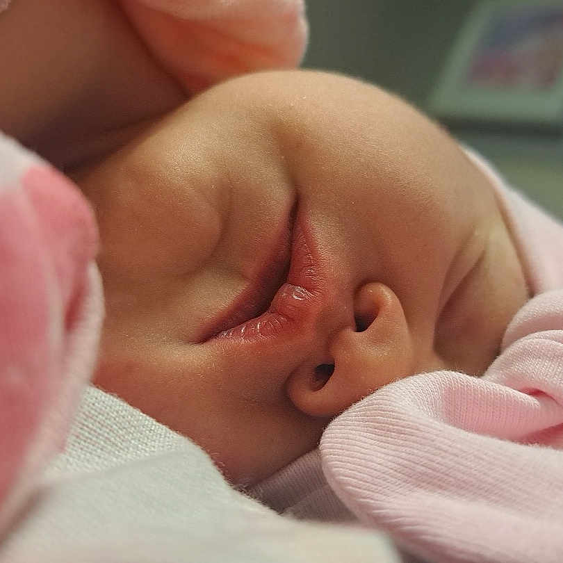 Everleigh joined the competition — help win amazing prizes! architecture, baby, blanket, bodypart, building, clothing, face, finger, glove, hand, head, hospital, mouth, newborn, person, photography, portrait, quilt, sleeping