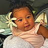 Remedyrose Garcia is registered to the contest to win money with this photo: baby, child, flower, blanket, car_interior, cute, face, portrait, infant, pink_clothing, curly_hair, smiling, indoors, soft_texture, wrapped, young_child, adorable, closeup, human, seat