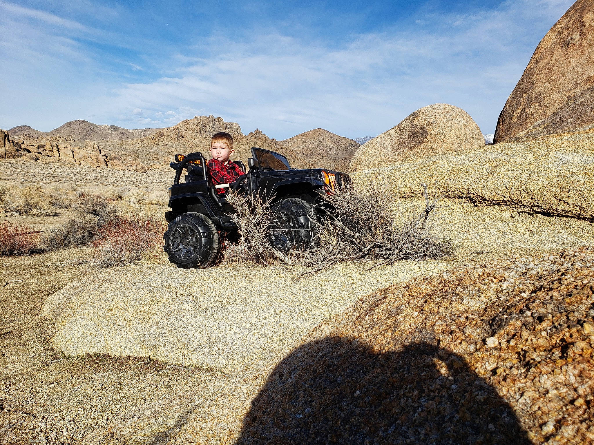 Hunter is registered to the contest to win money with this photo: adventure, adventure_game, all_terrain_vehicle, automotive_tire, badlands, car, geology, landscape, mountain, off_road_vehicle, off_roading, person, road, rock, soil, tire, tourism, vacation, valley, vehicle