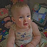 Kimi joined the competition — help win amazing prizes! baby, child, infant, dress, toys, stuffed_animals, blanket, face_stickers, indoor, sitting, cute, curious, soft_lighting, colorful, playful, young_child, home, comfort, portrait, smiling