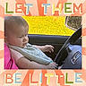 James joined the competition — help win amazing prizes! baby, child, car_interior, steering_wheel, seat, clothing, bib, window, reflection, face, hand, head, pink, yellow, green, orange, text_overlay, portrait, expression, side_view