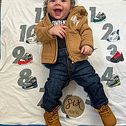 Dakego joined the competition — help win amazing prizes! baby, infant, smiling, clothing, jacket, jeans, boots, milestone, blanket, numbers, sneakers, carpet, happy, cute, portrait, child, indoor, person, six_months, wooden_sign