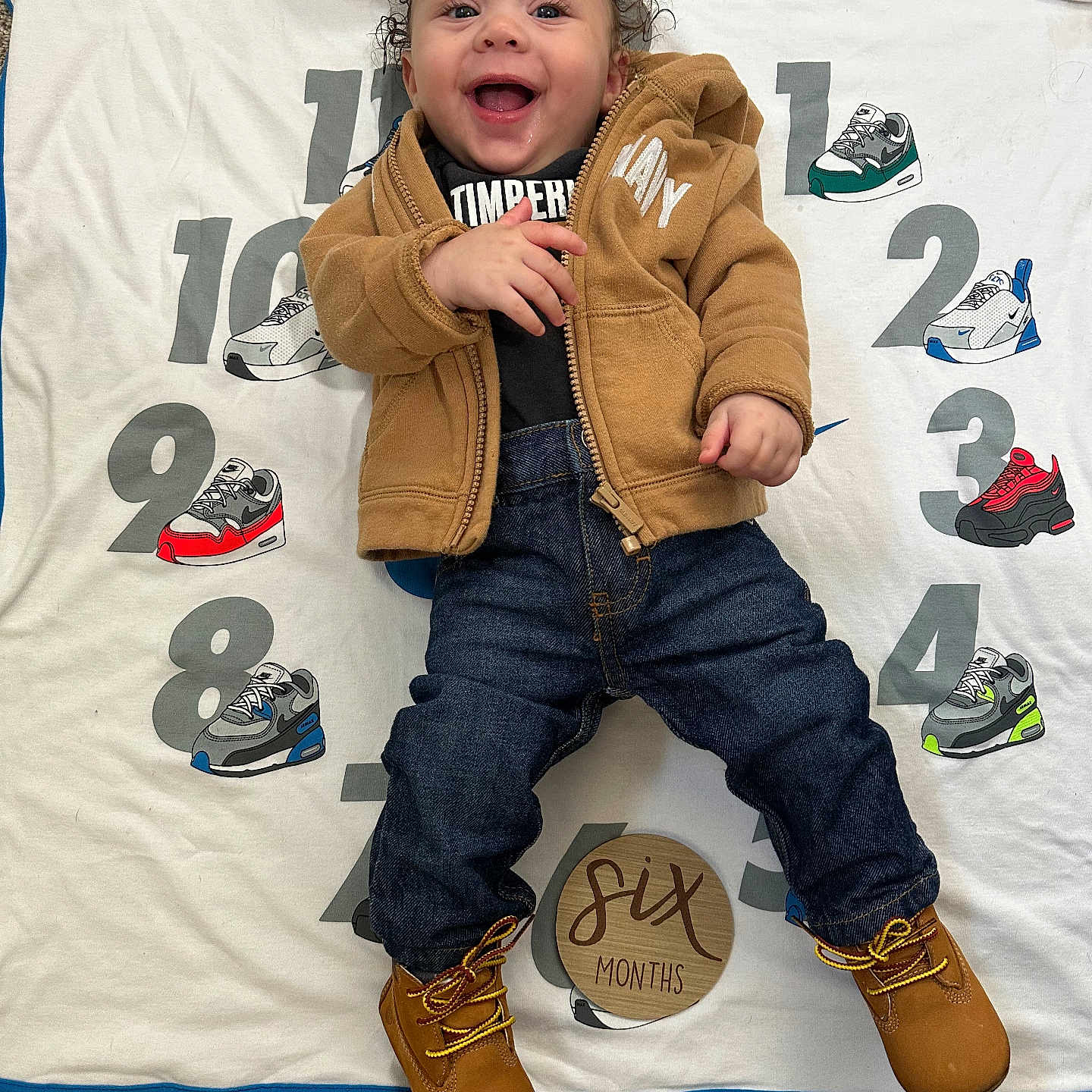 Dakego joined the competition — help win amazing prizes! baby, blanket, boots, carpet, child, clothing, cute, happy, indoor, infant, jacket, jeans, milestone, numbers, person, portrait, six_months, smiling, sneakers, wooden_sign