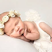 Sienna joined the competition — help win amazing prizes! newborn, baby, sleeping, flower_crown, white_blanket, infant, peaceful, soft_texture, closeup, portrait, cute, tiny_hands, tiny_feet, skin, headband, resting, cozy, innocence, studio, white_background