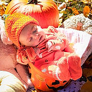 Hazel joined the competition — help win amazing prizes! baby, infant, sleeping, orange, knitted_hat, pumpkin_bucket, halloween, autumn_leaves, fall, outdoor, cozy, blanket, seasonal, cute, child, soft_toys, nature, festive, warm_clothing, relaxation