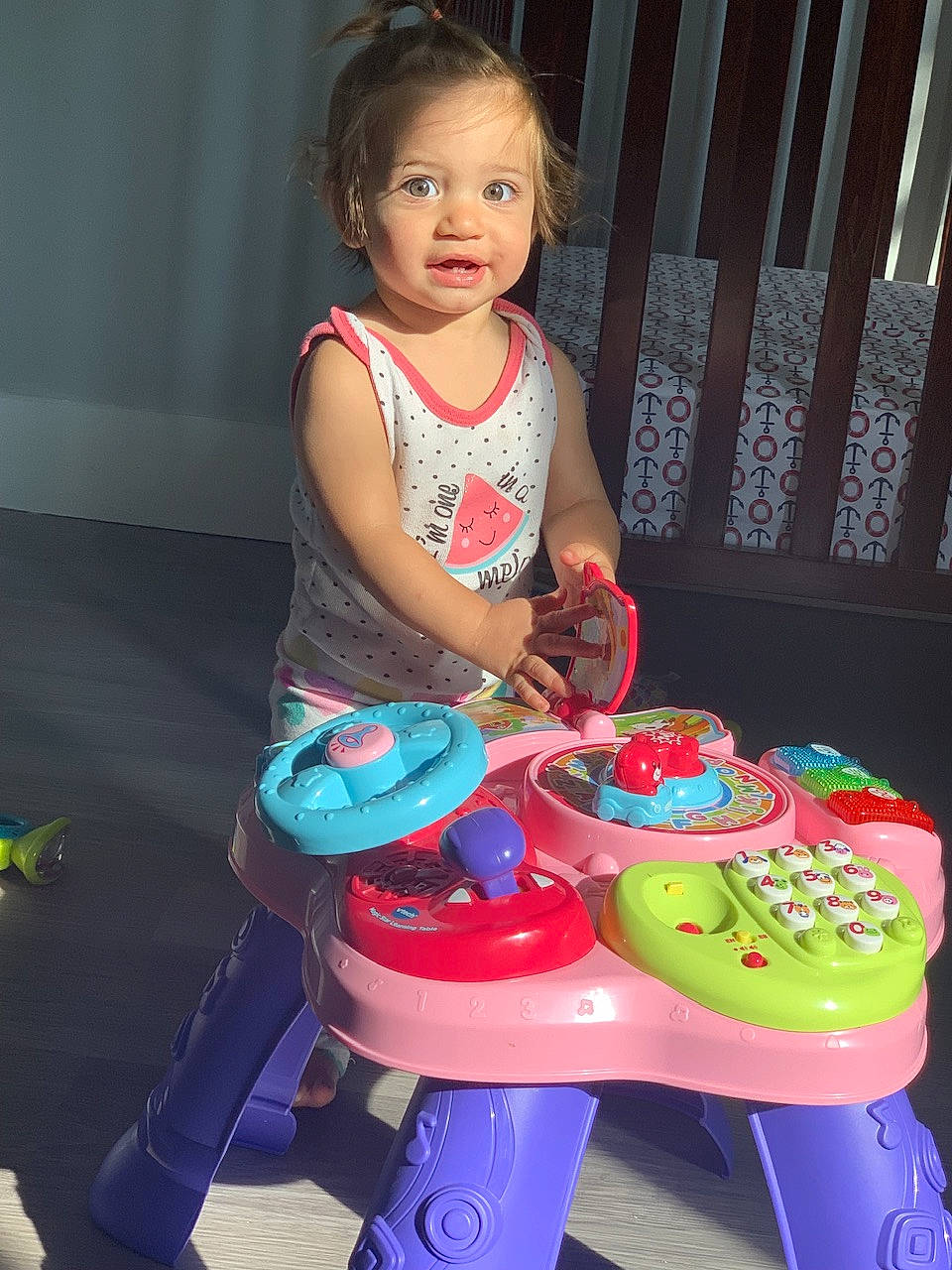 Amaya is registered to the contest to win money with this photo: baby_playing_with_toys, baby_toddler_clothing, chair, child, event, fun, happy, head, leisure, magenta, person, pink, plastic, play, recreation, riding_toy, sitting, t_shirt, toddler, toy