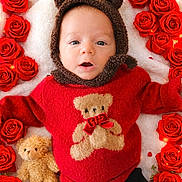 Romeo participe au concours pour gagner de l'argent avec cette photo : baby, infant, red_sweater, bear_hoodie, teddy_bear, roses, red_roses, flower_arrangement, plush_toy, cute, lying_down, soft_blanket, portrait, child, indoors, warm_clothing, adorable, looking_up, cozy, holiday_theme