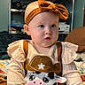 Everleigh joined the competition — help win amazing prizes! baby, child, headband, bow, cow, outfit, clothing, sitting, indoor, blanket, sleeves, cute, person, portrait, infant, face, expression, furniture, home, shelf