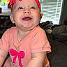 Everleigh joined the competition — help win amazing prizes! baby, infant, smiling, pink_headband, bow, pink_outfit, indoor, window_blinds, natural_light, happy, cute, child, person, skin, face, arms, sitting, young_child, portrait, home