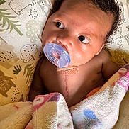 Mylos joined the competition — help win amazing prizes! baby, bear_pattern, blanket, child, closeup, comfort, curly_hair, cushion, cute, face, indoors, infant, lying_down, newborn, pacifier, resting, scar, skin, soft_texture, tree_pattern