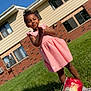 architecture, backyard, building, child, clothing, dress, face, grass, head, lawn, nature, neighborhood, outdoors, person, photography, plant, portrait, shelter, summer, yard