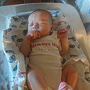 Haylyn is registered to the contest to win money with this photo: newborn, baby, sleeping, infant, child, portrait, hospital, bassinet, blanket, swaddle, onesie, socks, hands, feet, peaceful, indoors, nursery, medical, cozy, resting