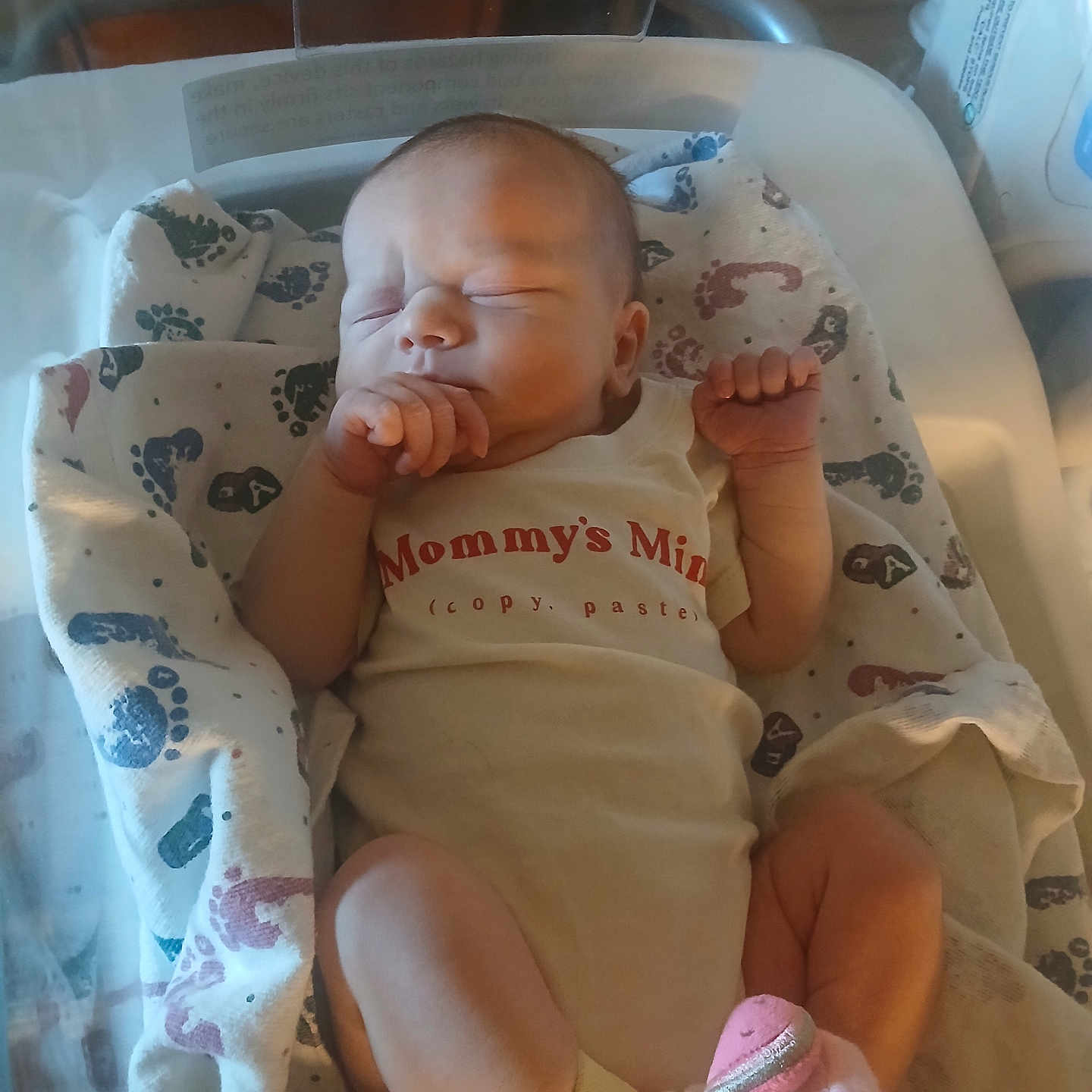 Haylyn is registered to the contest to win money with this photo: newborn, baby, sleeping, infant, child, portrait, hospital, bassinet, blanket, swaddle, onesie, socks, hands, feet, peaceful, indoors, nursery, medical, cozy, resting