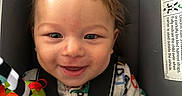 Kasen joined the competition — help win amazing prizes! baby, infant, car_seat, smile, happy, blanket, clothing, face, child, seatbelt, closeup, cute, indoors, head, person, portrait, toy, colorful, young, baby_toy