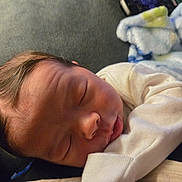 Ezekiel joined the competition — help win amazing prizes! baby, sleeping, newborn, face, infant, cozy, blanket, soft, closeup, child, peaceful, rest, cute, skin, portrait, small, hand, clothing, indoors, head