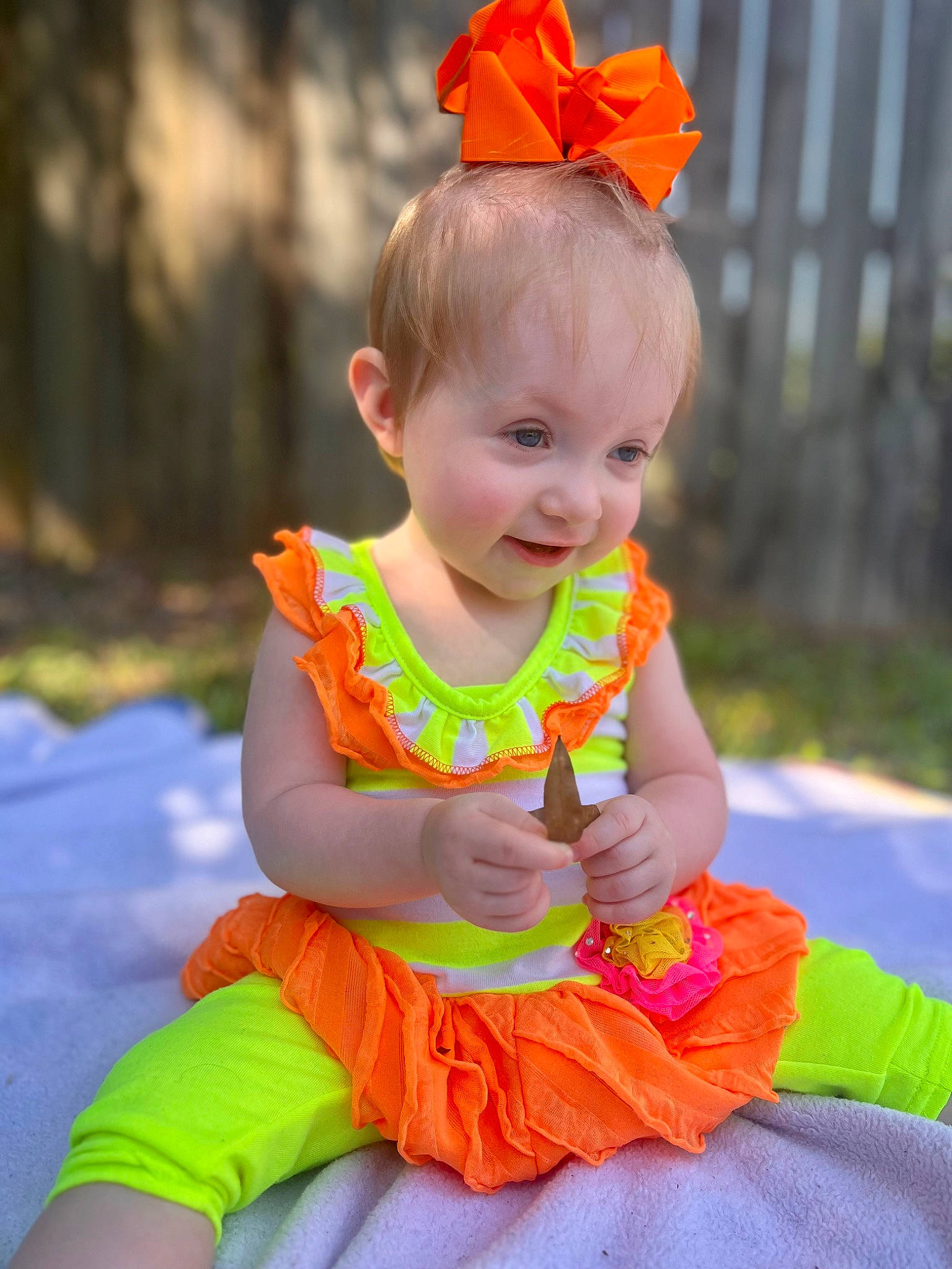 Autumn Gayle is registered to the contest to win money with this photo: baby, baby_toddler_clothing, child, dress, event, fun, grass, happy, leisure, magenta, orange, peach, person, pink, red, sitting, smile, spring, summer, t_shirt