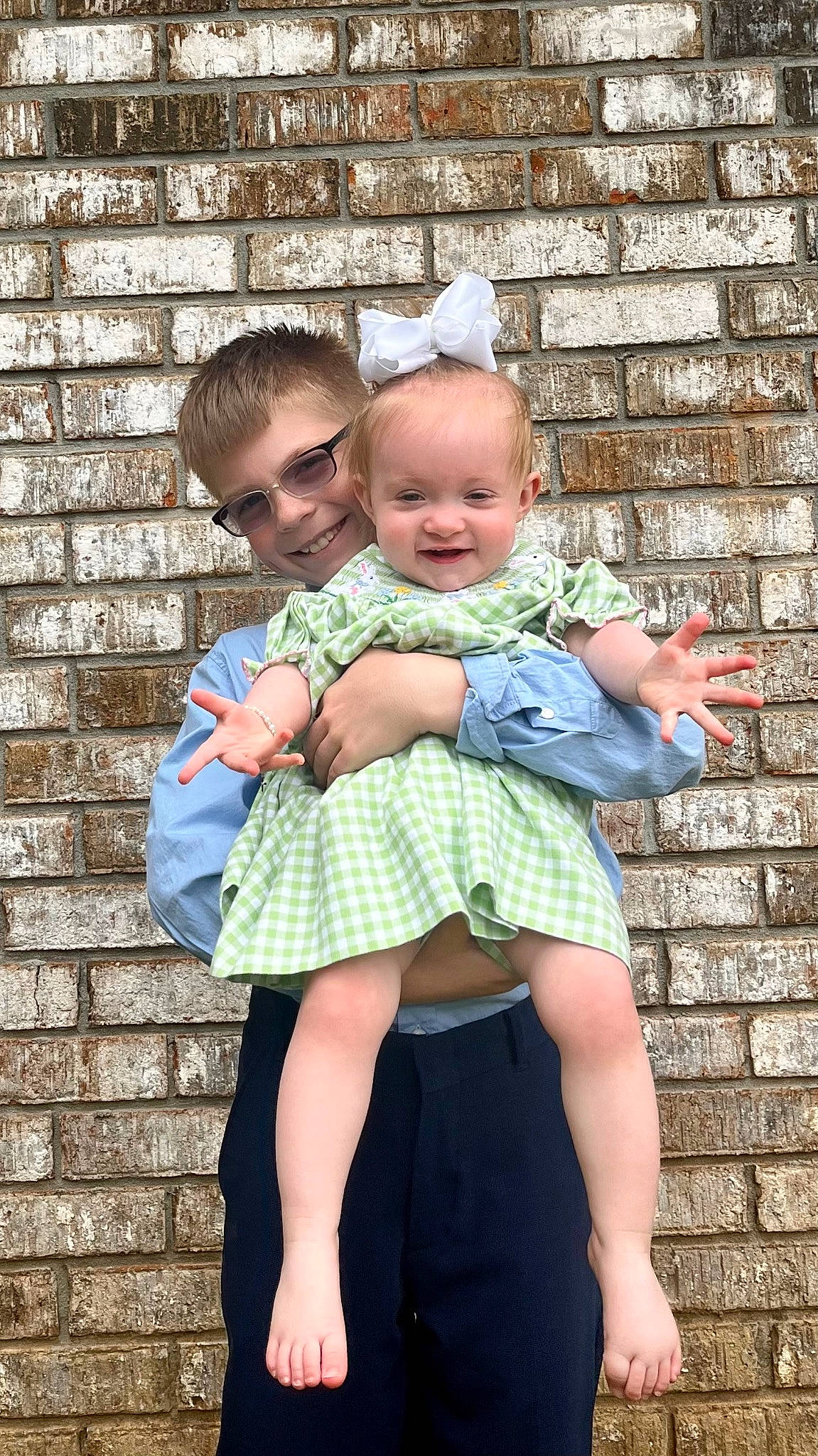 Autumn Gayle is registered to the contest to win money with this photo: azure, baby, baby_toddler_clothing, child, day_dress, facial_expression, fun, gesture, grass, happy, joy, pattern, people_in_nature, person, photograph, pink, plaid, sitting, smile, standing