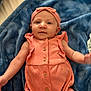 Marleyrae is registered to the contest to win money with this photo: baby, infant, child, pink_outfit, headband, blanket, blue_blanket, lying_down, buttoned_clothing, cute, portrait, indoor, soft_texture, comfortable, person, young_child, skin, expression, closeup, relaxed