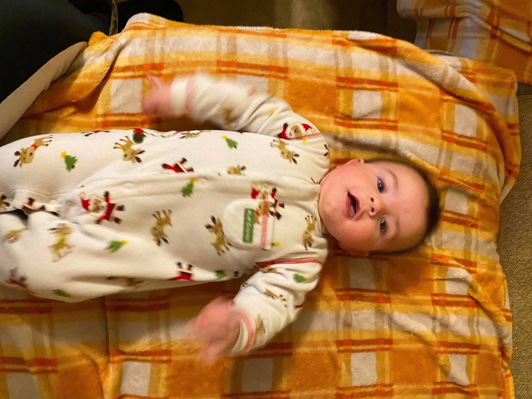 Arwyn is registered to the contest to win money with this photo: baby, baby_products, baby_safety, baby_toddler_clothing, bedtime, child, comfort, cradle, facial_expression, flooring, infant_bed, linens, orange, pattern, person, room, skin, sleeve, textile, toddler