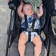 Rikku joined the competition — help win amazing prizes! baby, stroller, sleeping, infant, child, outdoor, pavement, sunlight, clothing, blanket, resting, safety_harness, legs, feet, head, person, summer, cute, relaxing, nap