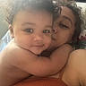 Zahmiyah Frison is registered to the contest to win money with this photo: adult, affection, baby, child, close_up, cuddle, curly_hair, face, family, hug, human, indoors, intimacy, love, person, portrait, skin, smile, tenderness, warmth