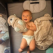 Jake joined the competition — help win amazing prizes! baby, infant, smiling, plush_toy, diaper, blanket, crib, playpen, pillow, lying_down, happy, cute, feet, hand, mesh_side, sock, soft_texture, nursery, portrait, toy_bear