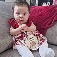 Jovi-May joined the competition — help win amazing prizes! baby, infant, child, sitting, couch, blanket, dress, white_socks, sign, four_months_old, rainbow, indoors, portrait, cute, hands_clasped, hair, face, expression, person, home