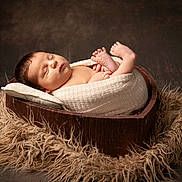Jovi-May is registered to the contest to win money with this photo: newborn, baby, sleeping, blanket, wooden_bowl, heart_shaped, fluffy_rug, cozy, portrait, infant, cute, peaceful, wrapped, soft_lighting, indoors, head, foot, skin, resting, toddler