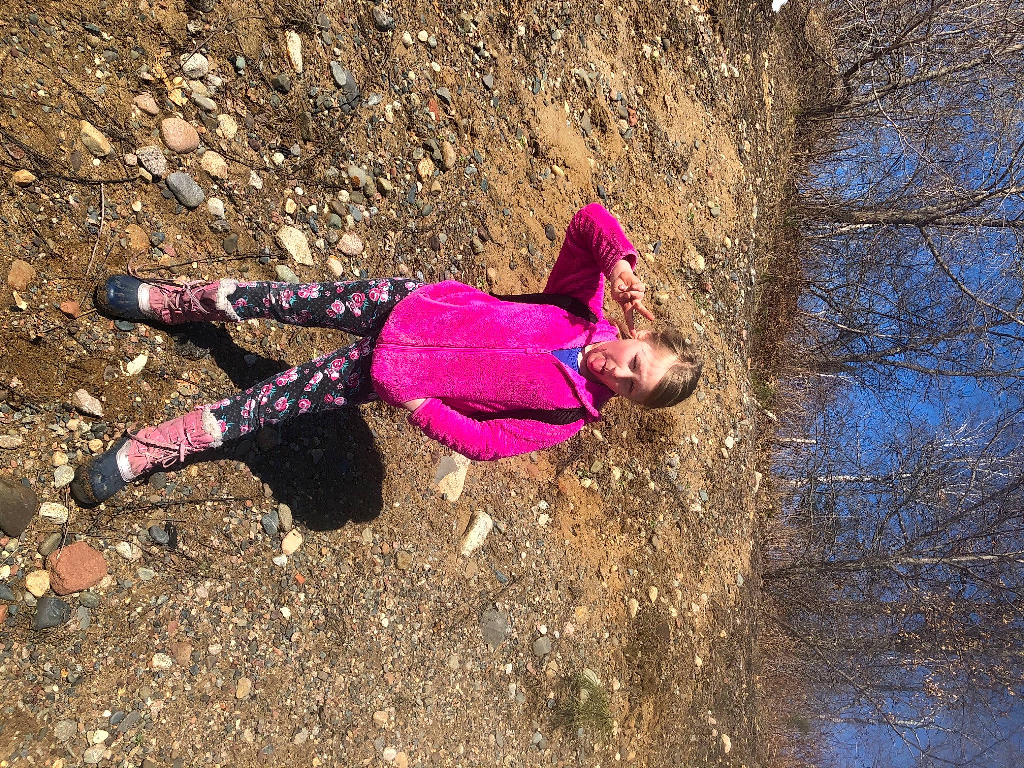 Sophia joined the competition — help win amazing prizes! adventure, fun, grass, happy, landscape, leisure, magenta, people_in_nature, person, recreation, sandal, shadow, sitting, soil, tree, trunk, winter, wood