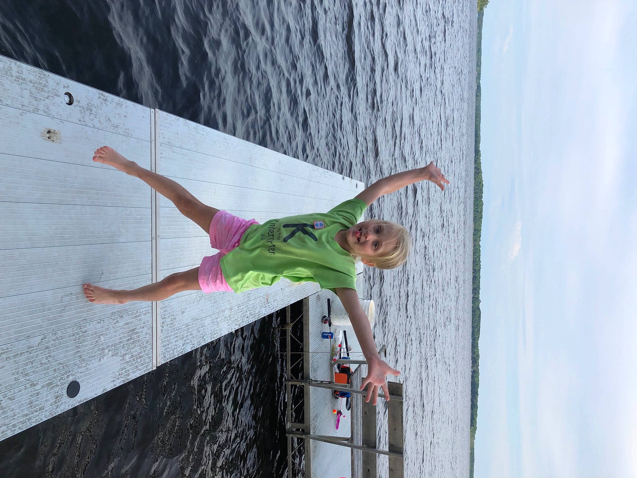 Sophia is registered to the contest to win money with this photo: adventure, azure, beach, cloud, coast, fun, happy, lake, leisure, ocean, person, recreation, shorts, sky, toddler, tree, vacation, wall, water, wind_wave