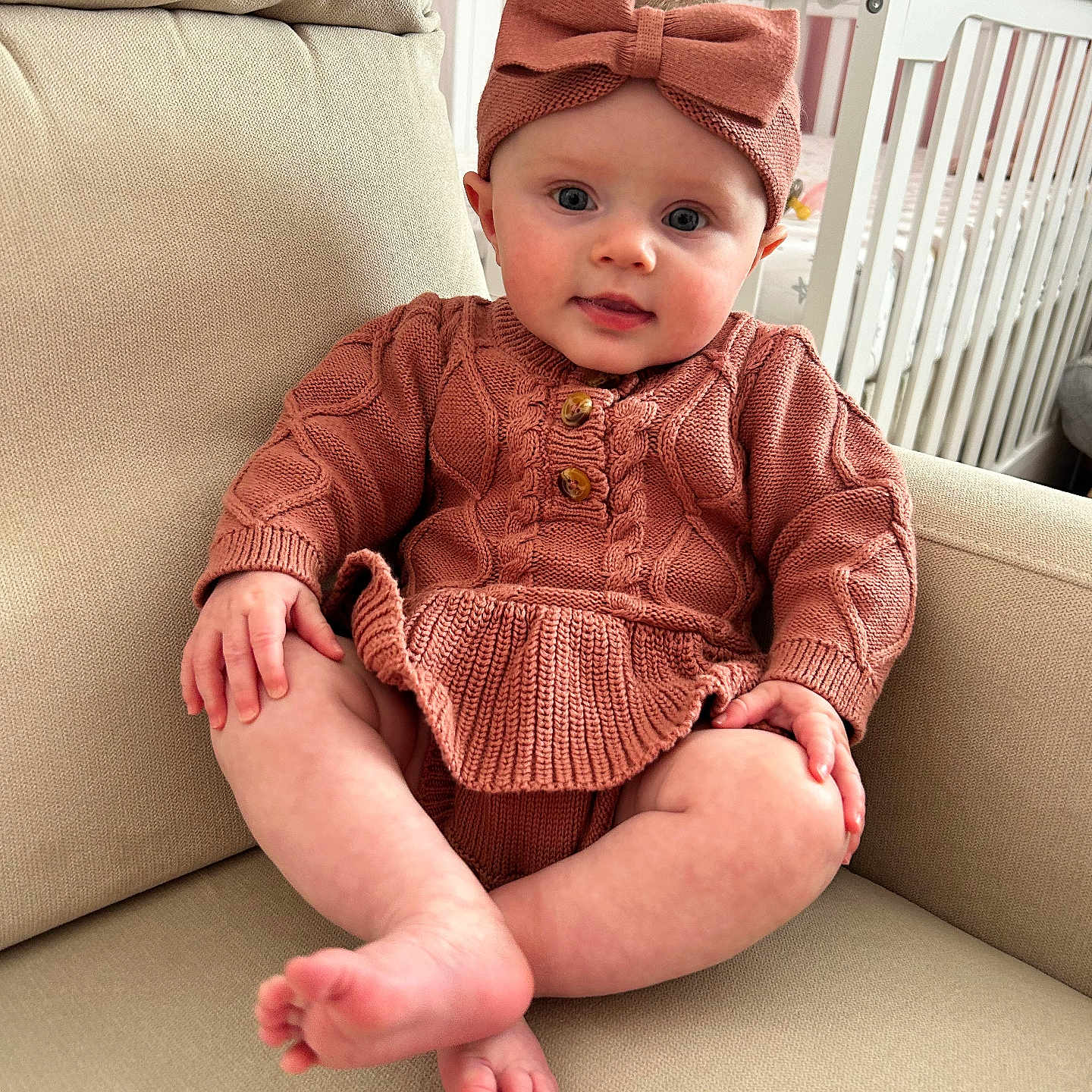 Hazel joined the competition — help win amazing prizes! baby, bodypart, cap, clothing, couch, crib, cushion, face, finger, furniture, hand, hat, head, indoors, infantbed, knitwear, person, photography, portrait, sweater