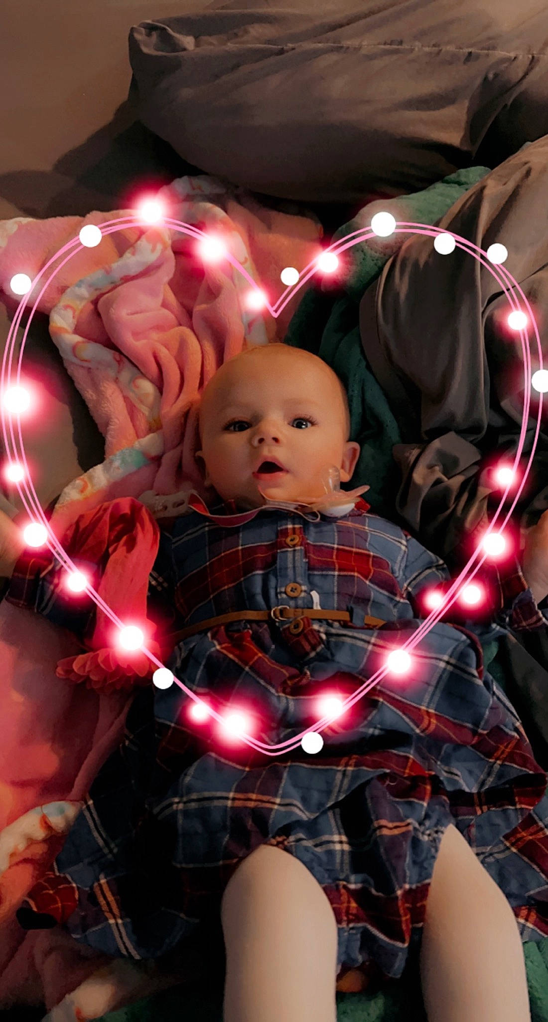 Jocelyn joined the competition — help win amazing prizes! baby, carmine, child, christmas, doll, event, fictional_character, fun, holiday, human, lap, light, lighting, pattern, person, pink, plaid, tartan, thigh, toddler