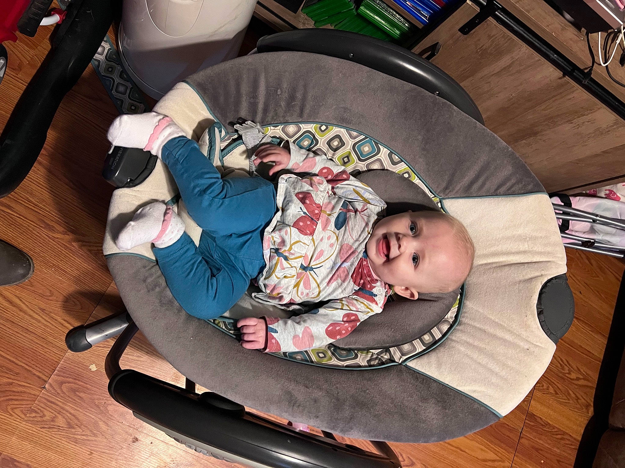 Jocelyn is registered to the contest to win money with this photo: auto_part, baby, baby_carriage, baby_products, baby_toddler_clothing, child, comfort, flooring, hardwood, lap, person, product, sitting, toddler, varnish, wood, wood_flooring