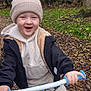 Carson joined the competition — help win amazing prizes! child, toddler, bike, outdoor, autumn, leaves, grass, tree, hat, jacket, hoodie, sneakers, smiling, happy, play, nature, park, young, person, fun