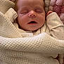 Olive joined the competition — help win amazing prizes! baby, newborn, sleeping, blanket, knitted, cushion, soft, pink, cream, face, closed_eyes, infant, cozy, cute, child, resting, indoors, portrait, wrapped, peaceful