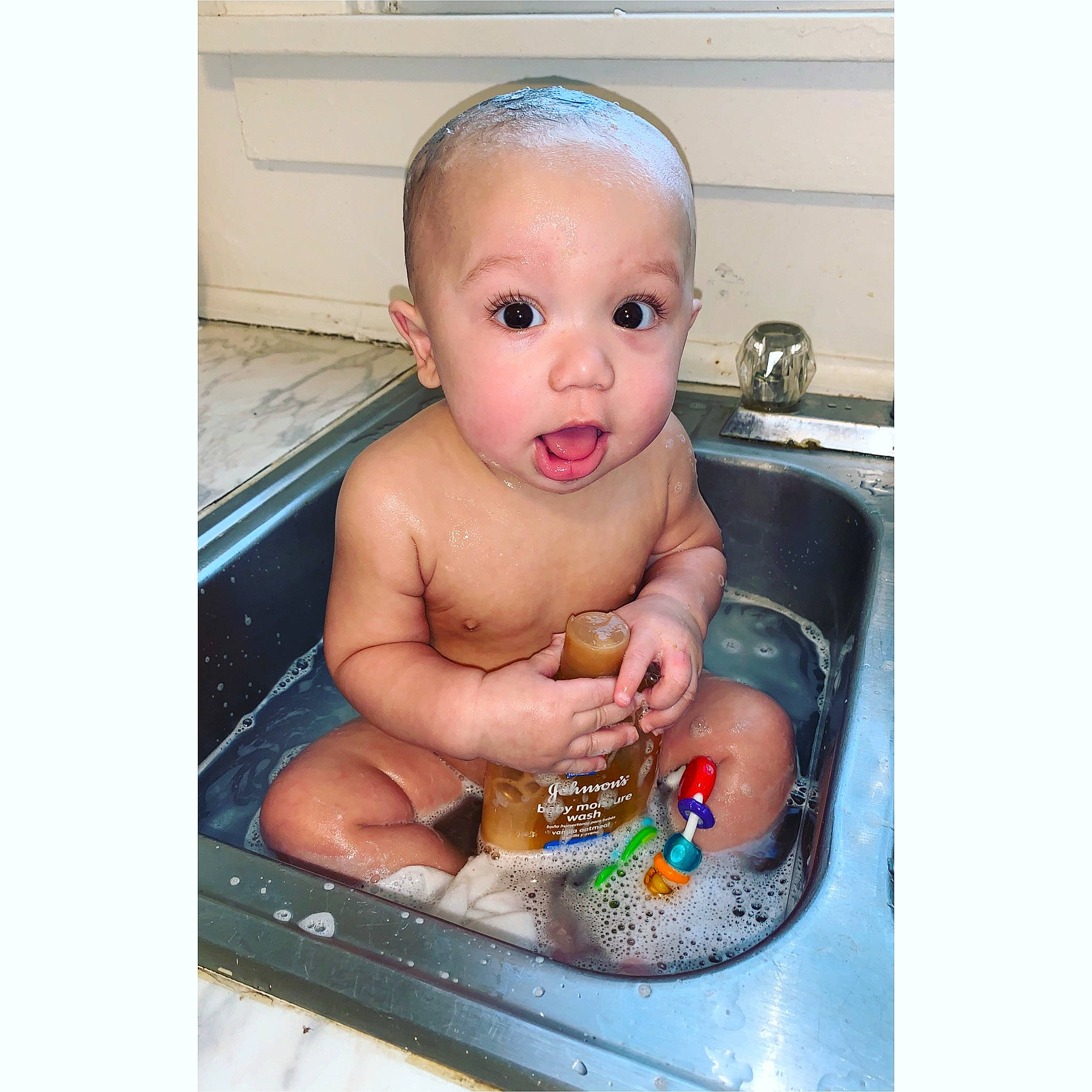 Kyrin joined the competition — help win amazing prizes! baby, baby_bathing, bathing, bathtub, cheek, child, face, forehead, hand, head, nose, person, product, smile, surprise, toddler, washing