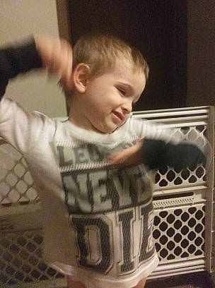 Xavier is registered to the contest to win money with this photo: arm, baby, cheek, child, cool, ear, facial_expression, forehead, hairstyle, nose, person, play, product, t_shirt, toddler