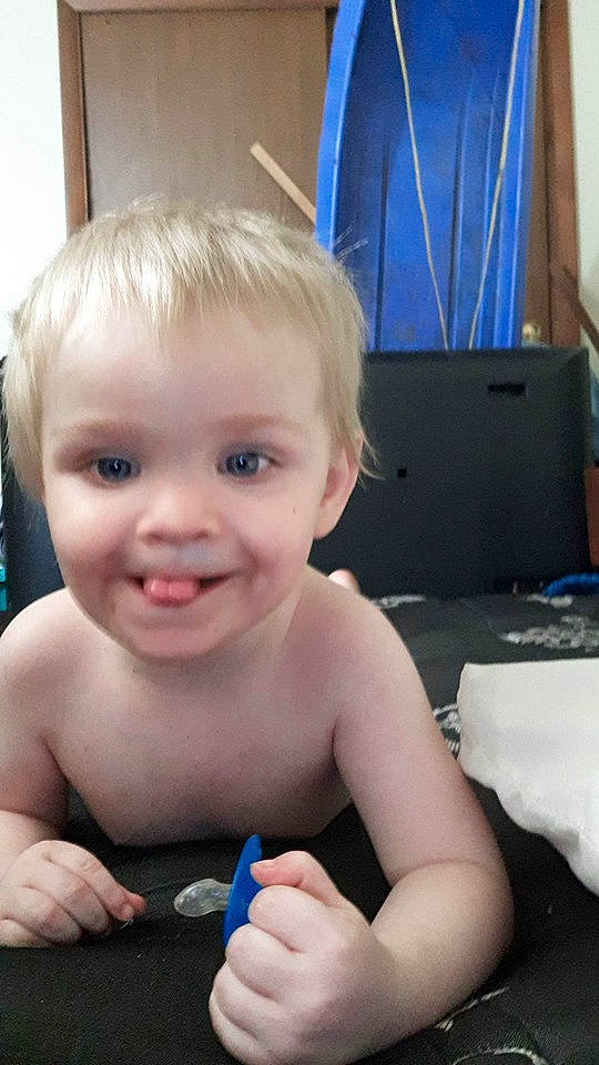 Ezrah is registered to the contest to win money with this photo: baby, blond, cheek, child, ear, face, finger, hair, hand, joy, mouth, nose, person, play, skin, smile, thumb, toddler