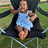 baby, child, smiling, blue_dress, striped, chair, outdoor, grass, happy, cute, sitting, black_chair, summer, sunny, portrait, infant, playful, person, curly_hair, barefoot