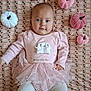 adorable, baby, baby_fashion, baby_girl, blue_eyes, child, childhood, cute, face, indoors, infant, lying_down, patterned_blanket, pink_clothing, plush_pumpkins, portrait, smiling_ghost, soft_toys, tutu, white_tights