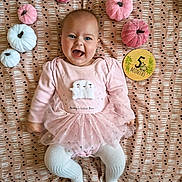 Gracie joined the competition — help win amazing prizes! 5_months, autumn_theme, baby, blanket, child, cozy, cute, face, happy, head, infant, lying_down, milestone_marker, patterned_background, pink_clothing, plush_pumpkins, smiling, soft_toys, tutu, white_tights