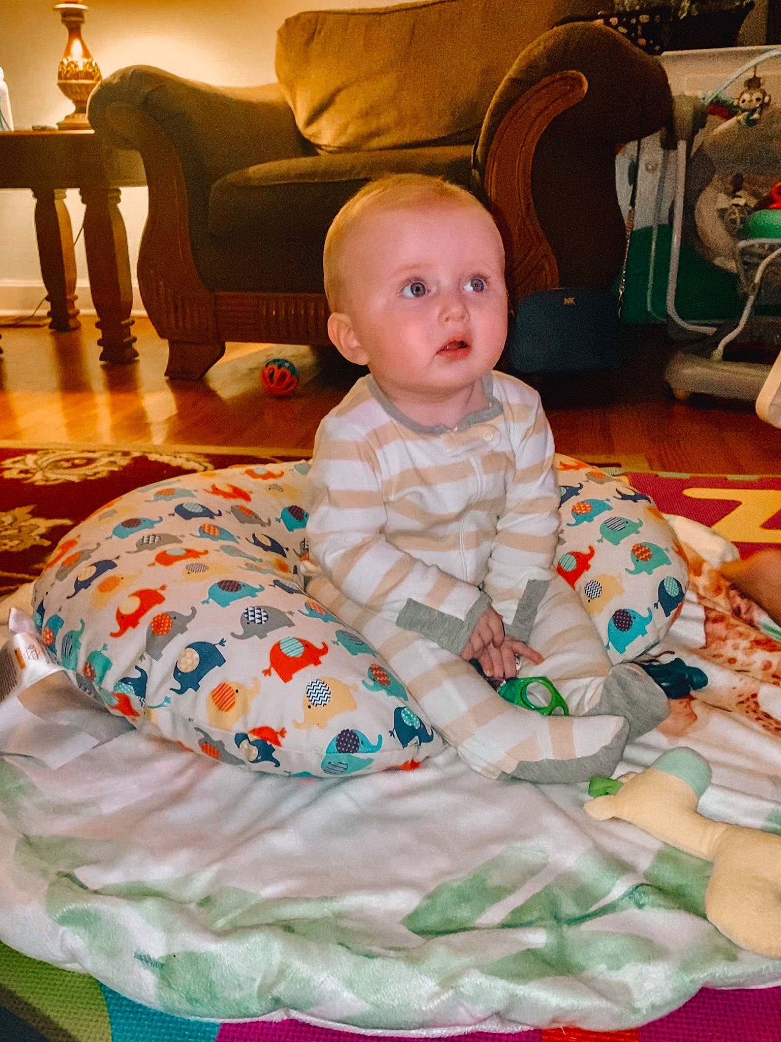Tucker joined the competition — help win amazing prizes! baby, baby_products, baby_toddler_clothing, chair, cheek, child, comfort, event, flooring, fun, furniture, hardwood, lap, leisure, living_room, pattern, person, room, sitting, surprise
