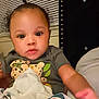Ziaire is registered to the contest to win money with this photo: baby, bed, blanket, bodypart, clothing, couch, crib, cushion, face, finger, furniture, hand, head, homedecor, infantbed, newborn, person, photography, portrait, toy