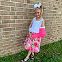 architecture, brick, building, child, clothing, dress, face, female, footwear, girl, glove, grass, head, person, photography, plant, portrait, sandal, skirt, wall